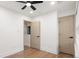 Bedroom with wood floors, a ceiling fan, and light-filled doorways, creating a bright and airy space at 130 Valley Glen Dr, Troutman, NC 28166