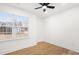 Bedroom featuring wood flooring, ceiling fan, and window at 130 Valley Glen Dr, Troutman, NC 28166