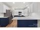Modern kitchen with stainless steel appliances, ample countertop space, and custom cabinetry at 130 Valley Glen Dr, Troutman, NC 28166