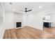 Inviting living room featuring a cozy fireplace, hardwood floors, and modern lighting at 130 Valley Glen Dr, Troutman, NC 28166