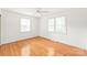Bedroom featuring hardwood floors, neutral walls, and two windows for bright natural light at 1320 Hartford Ave, Charlotte, NC 28209