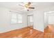 Cozy bedroom with hardwood floors, mirrored closet doors, and natural light at 1320 Hartford Ave, Charlotte, NC 28209