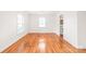 Hardwood floored dining area bathed in natural light from large windows, conveniently located near kitchen at 1320 Hartford Ave, Charlotte, NC 28209