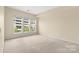 A bright bedroom with large windows and neutral carpet at 14853 Santa Lucia Dr, Charlotte, NC 28277