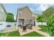 Backyard patio with outdoor seating creating an inviting space for relaxation and entertaining at 16425 Spruell St, Huntersville, NC 28078