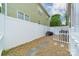 Fenced backyard with gravel, patio and grill, offering privacy and space for outdoor enjoyment at 16425 Spruell St, Huntersville, NC 28078