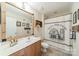 Charming bathroom with custom mirror, neutral tones and vanity space, offering a serene and inviting atmosphere at 16425 Spruell St, Huntersville, NC 28078