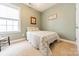 Bright bedroom with large window and neutral carpet at 16425 Spruell St, Huntersville, NC 28078