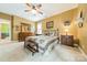 Spacious bedroom with neutral walls and carpet features a ceiling fan and plenty of space at 16425 Spruell St, Huntersville, NC 28078