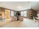 Large bonus room offers versatile space, natural light, and potential for a home office or media center at 16425 Spruell St, Huntersville, NC 28078