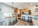 Open-concept dining area with a combination of wood and granite countertops, connecting to kitchen for easy entertaining and daily living at 16425 Spruell St, Huntersville, NC 28078