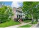 Charming two-story home with a welcoming porch and beautifully landscaped front yard, blending classic charm with modern curb appeal at 16425 Spruell St, Huntersville, NC 28078