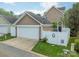 Charming home featuring a two-car garage and an enclosed backyard, perfect for outdoor gatherings at 16425 Spruell St, Huntersville, NC 28078