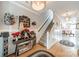 Warm and inviting foyer featuring hardwood floors, elegant decor, and a staircase leading to the upper level of the home at 16425 Spruell St, Huntersville, NC 28078