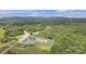 Aerial view of the property with boundary lines, lush greenery, and surrounding trees at 1770 Nc 90 W Hwy, Taylorsville, NC 28681