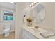 Bright bathroom with a white vanity, an oval mirror, and a towel rack at 1770 Nc 90 W Hwy, Taylorsville, NC 28681
