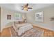 Bright bedroom features hardwood floors, a neutral color palette, and a ceiling fan at 1770 Nc 90 W Hwy, Taylorsville, NC 28681