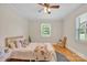 Comfortable bedroom features hardwood floors, plenty of natural light, and warm, neutral colors at 1770 Nc 90 W Hwy, Taylorsville, NC 28681