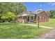 Charming brick home with a cozy front porch and beautifully landscaped front yard at 1770 Nc 90 W Hwy, Taylorsville, NC 28681