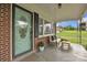 Inviting front porch with seating, a decorative rug, and an attractively painted front door at 1770 Nc 90 W Hwy, Taylorsville, NC 28681