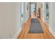 Hallway with hardwood floors and neutral walls provides access to multiple rooms at 1770 Nc 90 W Hwy, Taylorsville, NC 28681
