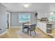 Charming eat-in kitchen with natural light, and open shelving, and a cozy breakfast nook at 1770 Nc 90 W Hwy, Taylorsville, NC 28681