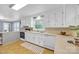 Well-lit kitchen featuring sleek white cabinets, modern appliances, and a functional layout at 1770 Nc 90 W Hwy, Taylorsville, NC 28681