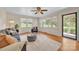 Bright living room filled with natural light, hardwood floors, ceiling fan and comfortable seating at 1770 Nc 90 W Hwy, Taylorsville, NC 28681