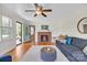 Inviting living room with a cozy brick fireplace, open floor plan, and lots of natural light at 1770 Nc 90 W Hwy, Taylorsville, NC 28681