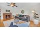 Stylish living room featuring a charming brick fireplace, modern furnishings, and hardwood floors at 1770 Nc 90 W Hwy, Taylorsville, NC 28681