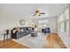 Comfortable living room with hardwood floors, bright windows, ceiling fan and modern furnishings at 1770 Nc 90 W Hwy, Taylorsville, NC 28681