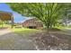 Brick home with a wooden deck and picnic table at 1770 Nc 90 W Hwy, Taylorsville, NC 28681