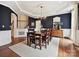 Elegant dining room with wood floors, wainscoting, and a decorative chandelier at 18419 Dembridge Dr, Davidson, NC 28036