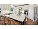 Kitchen island with quartz countertops and woven stools at 18419 Dembridge Dr, Davidson, NC 28036