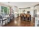 Open kitchen with white cabinets, stainless steel appliances, island, and breakfast area at 18419 Dembridge Dr, Davidson, NC 28036
