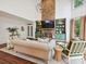 Cozy living room with a floor-to-ceiling brick fireplace and built-in shelving at 18419 Dembridge Dr, Davidson, NC 28036