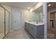 Bathroom featuring dual sink vanity, tile floors, and walk-in shower at 1983 Paddlewheel Dr, Stanley, NC 28164