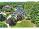 Aerial view of a grand home with lush landscaping and mature trees in a desirable neighborhood at 2004 Garden View Ln, Weddington, NC 28104