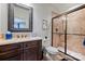 The bathroom offers a tile shower, elegant mirror, and stylish vanity for a sleek and updated look at 2004 Garden View Ln, Weddington, NC 28104