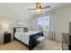 Comfortable bedroom featuring a sleigh bed, natural light, and neutral tones at 2004 Garden View Ln, Weddington, NC 28104