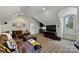 Comfortable bonus room featuring a wet bar, large TV, and an oversized sectional couch at 2004 Garden View Ln, Weddington, NC 28104