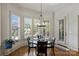 Bright breakfast nook with bay windows, plantation shutters, and hardwood floors at 2004 Garden View Ln, Weddington, NC 28104