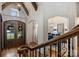 Elegant foyer, dining room, and staircase with beautiful wood accents creates inviting home at 2004 Garden View Ln, Weddington, NC 28104