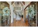 Welcoming foyer with curved staircase, wood floors, and elegant details sets a luxurious tone at 2004 Garden View Ln, Weddington, NC 28104