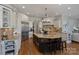 Gourmet kitchen with a large island, stainless appliances, and granite countertops at 2004 Garden View Ln, Weddington, NC 28104