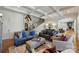 Comfortable living room featuring two sofas, chairs, an ottoman, and stairway with wood accents at 2004 Garden View Ln, Weddington, NC 28104