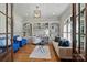 Bright home office with custom built-ins, hardwood floors, and ample natural light at 2004 Garden View Ln, Weddington, NC 28104