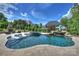 Resort-style pool with waterfall feature, sun loungers, and outdoor fireplace for ultimate relaxation at 2004 Garden View Ln, Weddington, NC 28104