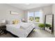 Bright bedroom with a large window, stylish decor, and a comfortable bed, creating a serene space at 2104 New Hope Branch Way, Belmont, NC 28012