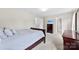 Well-lit bedroom featuring soft natural lighting, stylish furniture, and a mounted television at 2104 New Hope Branch Way, Belmont, NC 28012